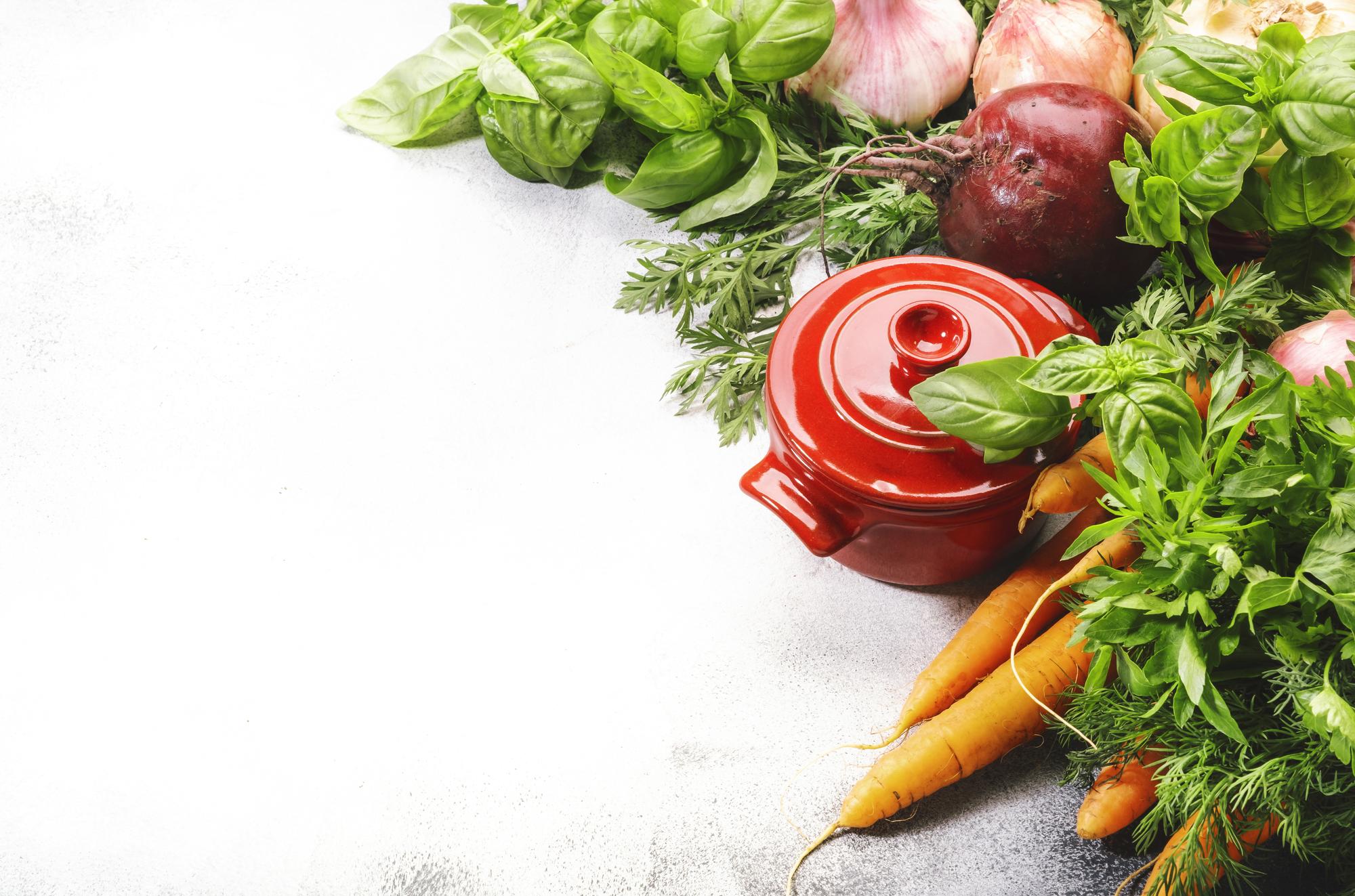 Flatlay of fresh market vegetables and herbs